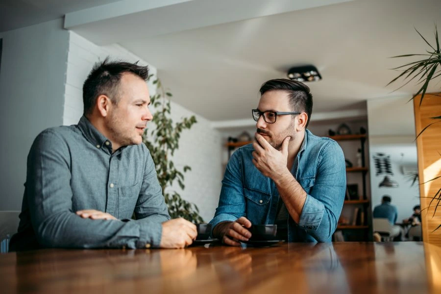 Men talking at a table